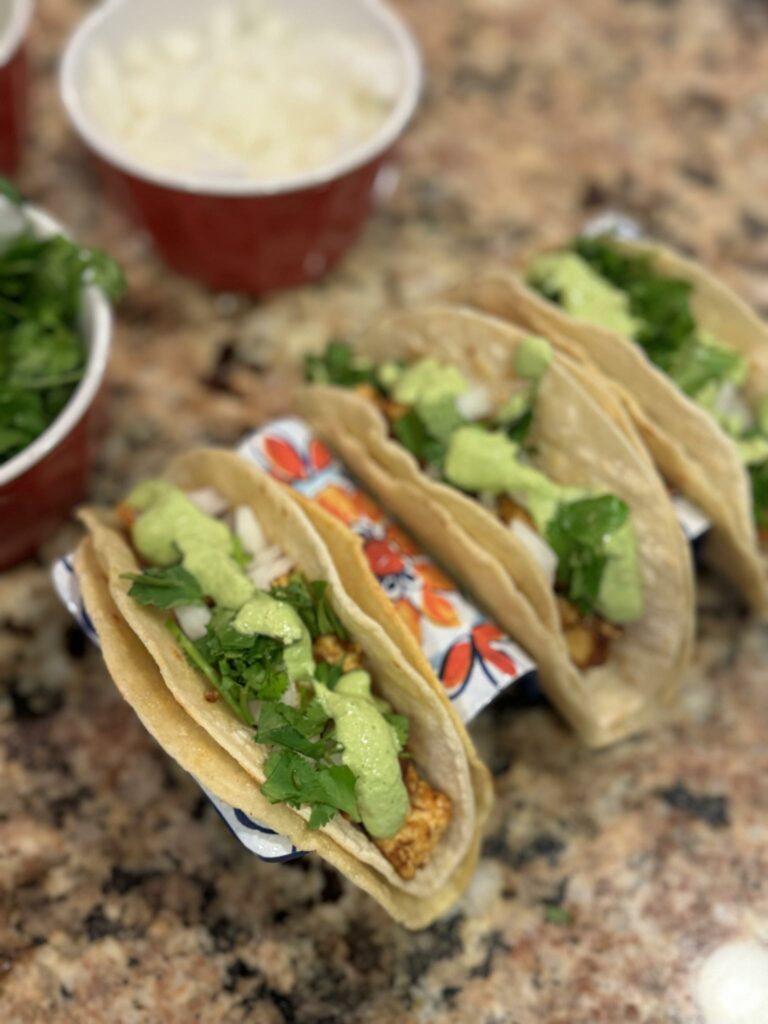 two-tacos-shown-with-sauce
